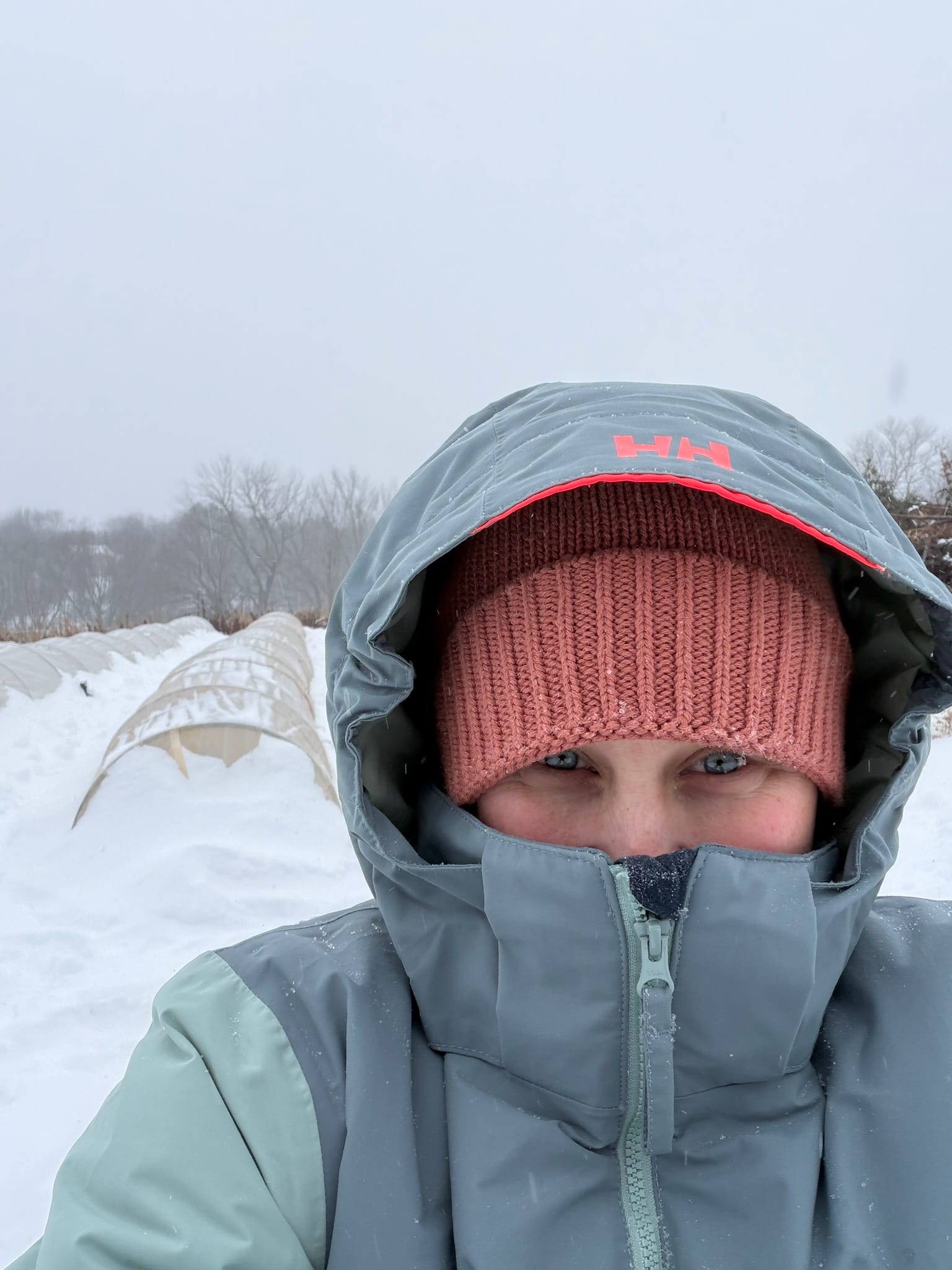 A grower bundled up against the cold on an early morning at the farm